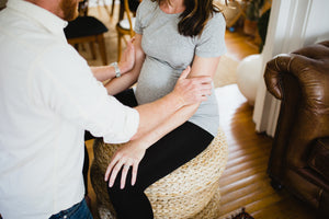 Couple in labor doing massage technique to reduce pain